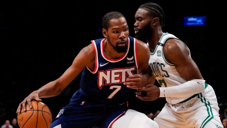 Brooklyn Nets forward Kevin Durant (7) drives against Boston Celtics guard Jaylen Brown, right, during the first half of Game 4 of a first-round playoff series. (John Minchillo/AP)