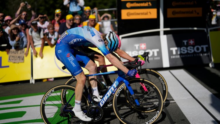 Australia's Nicholas Schultz, front, and Denmark's Magnus Cort Nielsen sprint to cross the finish of the tenth stage of the Tour de France cycling race over 148.5 kilometers (92.3 miles) with start in Morzine les Portes du Soleil and finish in Megeve, France, Tuesday, July 12, 2022. Magnus Cort Nielsen won the stage (Thibault Camus/AP)