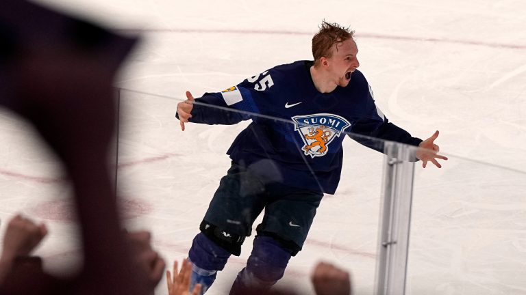 Finland's Sakari Manninen celebrates after the scored the decisive sudden death goal during the Hockey World Championship final match between Finland and Canada in Tampere, Finland, Sunday May 29, 2022. Finland became world champion after beating Canada 4-3 in overtime. (Martin Meissner/AP)