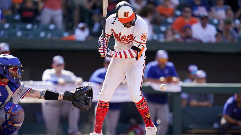 Baltimore Orioles' Jorge Mateo is hit by a pitch from Texas Rangers relief pitcher Matt Moore with the bases loaded to give the Orioles the walkoff win during the 10th inning of a baseball game, Monday, July 4, 2022, in Baltimore. The Orioles won 7-6 in ten innings. (Julio Cortez/AP)