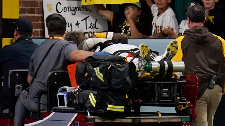 San Diego Padres left fielder Jurickson Profar leaves on a cart after colliding with shortstop C.J. Abrams during the fifth inning of a baseball game against the San Francisco Giants, Thursday, July 7, 2022, in San Diego. Profar and Abrams collided as Abrams made a catch for an out against Giants' Tommy La Stella. (Gregory Bull/AP Photo)