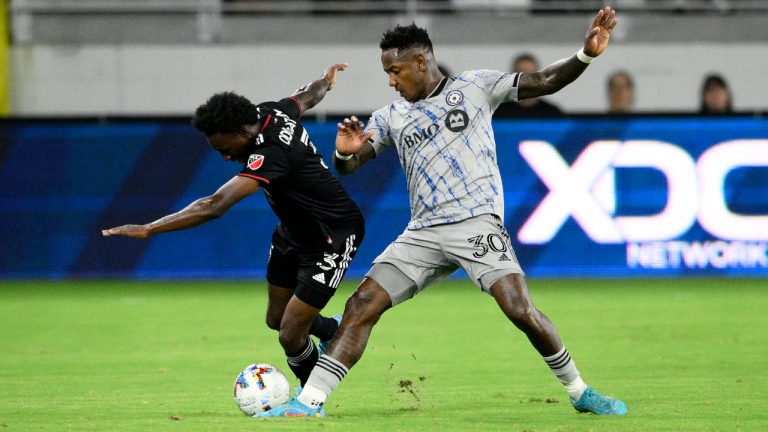 CF Montreal forward Romell Quioto (30) vies for the ball against D.C. United defender Chris Odoi-Atsem (3) during the second half of an MLS soccer match Saturday, July 23, 2022, in Washington. CF Montreal won 2-1. (Nick Wass/AP)