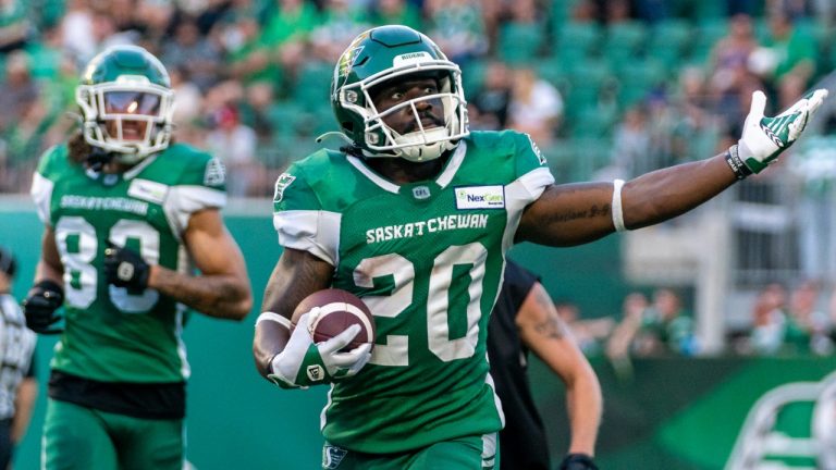 Saskatchewan Roughriders running back Frankie Hickson (20) celebrates after scoring a touchdown against the Ottawa Redblacks during first half of CFL football action in Regina, Friday, July 8, 2022. (Heywood Yu/THE CANADIAN PRESS)