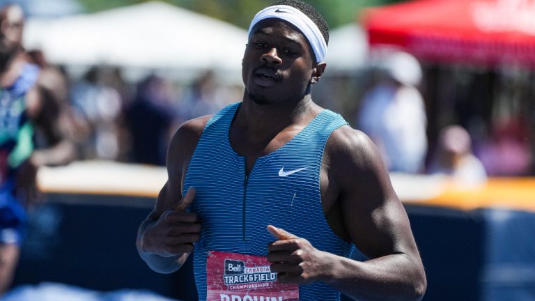 Aaron Brown, of Toronto, races to a first place finish in the men's 200 metre final at the Canadian Track and Field Championships in Langley, B.C., on Sunday, June 26, 2022. (Darryl Dyck/CP)