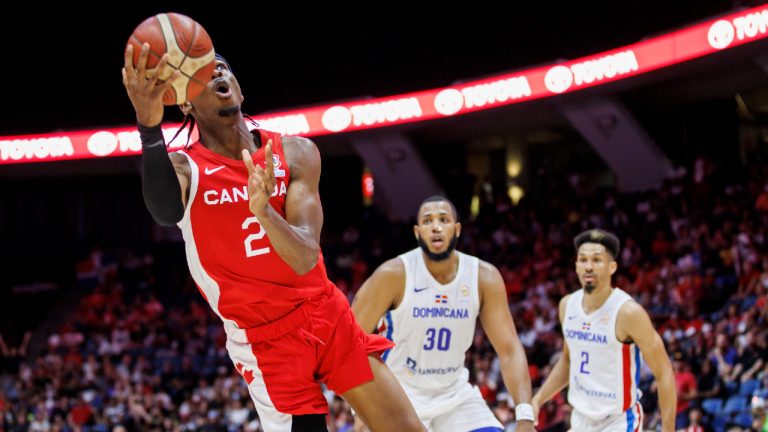 Canada's Shai Gilgeous-Alexander (2) drives to the net during first half FIBA international men's World Cup basketball qualifying action against Dominican Republic, in Hamilton, Ont., Friday, July 1, 2022. (Cole Burston/CP)