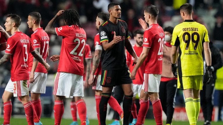 Ajax's Sebastien Haller, left, cheers Benfica's Julian Weigl at the end of the Champions League round of 16, first leg, soccer match between Benfica and Ajax at the Luz stadium in Lisbon, Wednesday, Feb. 23, 2022. (Armando Franca/AP)