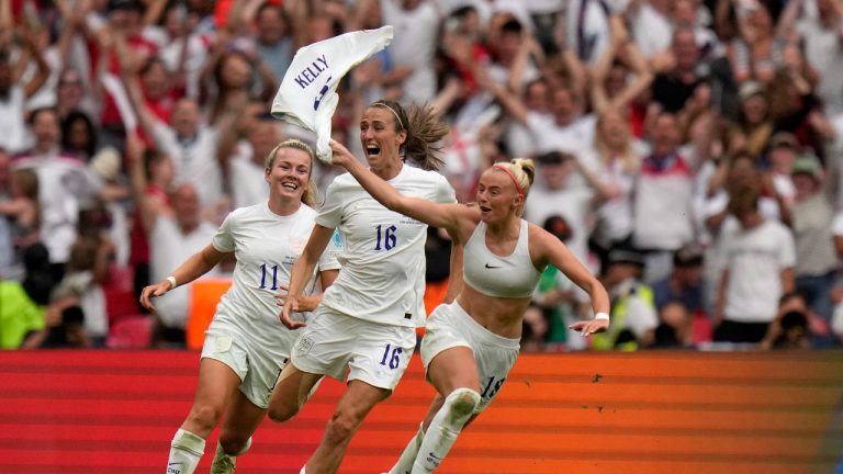 England's Chloe Kelly, right, celebrates after scoring her side's second goal during the Women's Euro 2022 final soccer match between England and Germany at Wembley stadium in London, Sunday, July 31, 2022. (Alessandra Tarantino/AP)