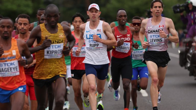 Galen Rupp, of the United States, and Cam Levins of Canada (right) compete during the men's marathon at the World Athletics Championships Sunday, July 17, 2022, in Eugene, Ore. (Patrick Smith/Pool Photo via AP)
