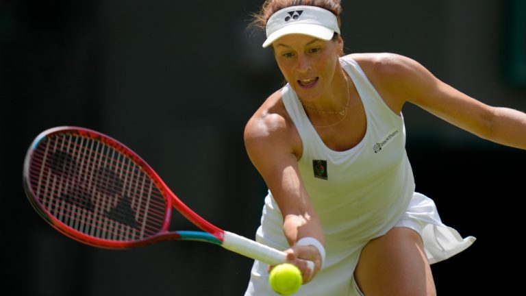 Germany's Tatjana Maria plays a return to Germany's Jule Niemeier in a women's singles quarterfinal match at the Wimbledon tennis championships in London, Tuesday July 5, 2022. (AP)