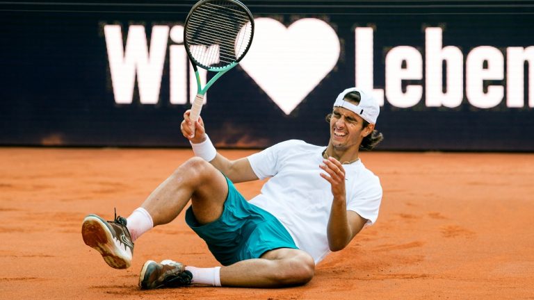 Italy's Lorenzo Musetti celebrates beating Spain's Carlos Alcaraz, at the Hamburg tennis tournament, Germany, Sunday July 24, 2022. (Daniel Bockwoldt/AP)