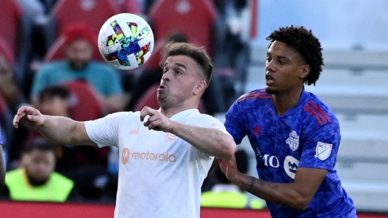 Chicago Fire FC’s Xherdan Shaqiri fights for possession of the ball with Toronto FC’s Kosi Thompson during first half MLS soccer action in Toronto on Saturday, May 28, 2022. Toronto FC and the Chicago Fire, two teams in need of a change of fortune, meet Wednesday night at Soldier Field. (Jon Blacker/CP)