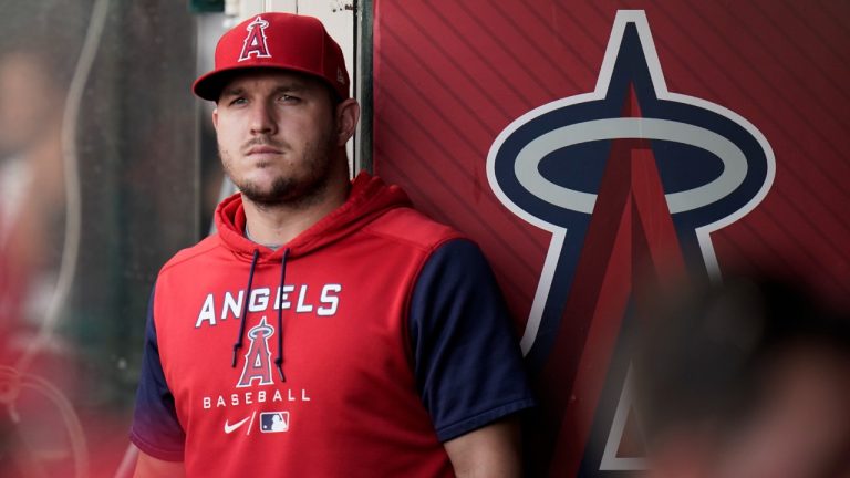 Los Angeles Angels' Mike Trout stands in the dugout before the team's baseball game against the Texas Rangers on Saturday, July 30, 2022, in Anaheim, Calif. (Jae C. Hong/AP)