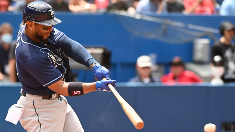 Tampa Bay Rays' Wander Franco hits an RBI single scoring Taylor Walls in eighth inning American League baseball action against the Toronto Blue Jays in Toronto, Saturday, July 2, 2022. (Jon Blacker/CP)