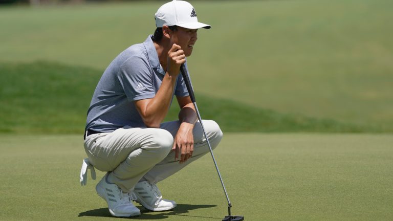 Brandon Wu lines up a putt on the first hole during the third round of the Wyndham Championship golf tournament in Greensboro, N.C., Saturday, Aug. 6, 2022. (Chuck Burton/AP)