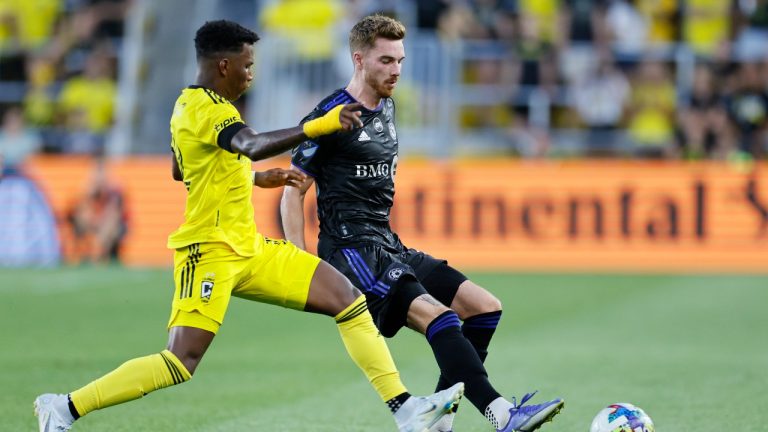 Columbus Crew's Luis Diaz, left, and CF Montreal's Joel Waterman chase the ball during the first half of an MLS soccer match Wednesday, Aug. 3, 2022, in Columbus, Ohio. (AP Photo/Jay LaPrete)