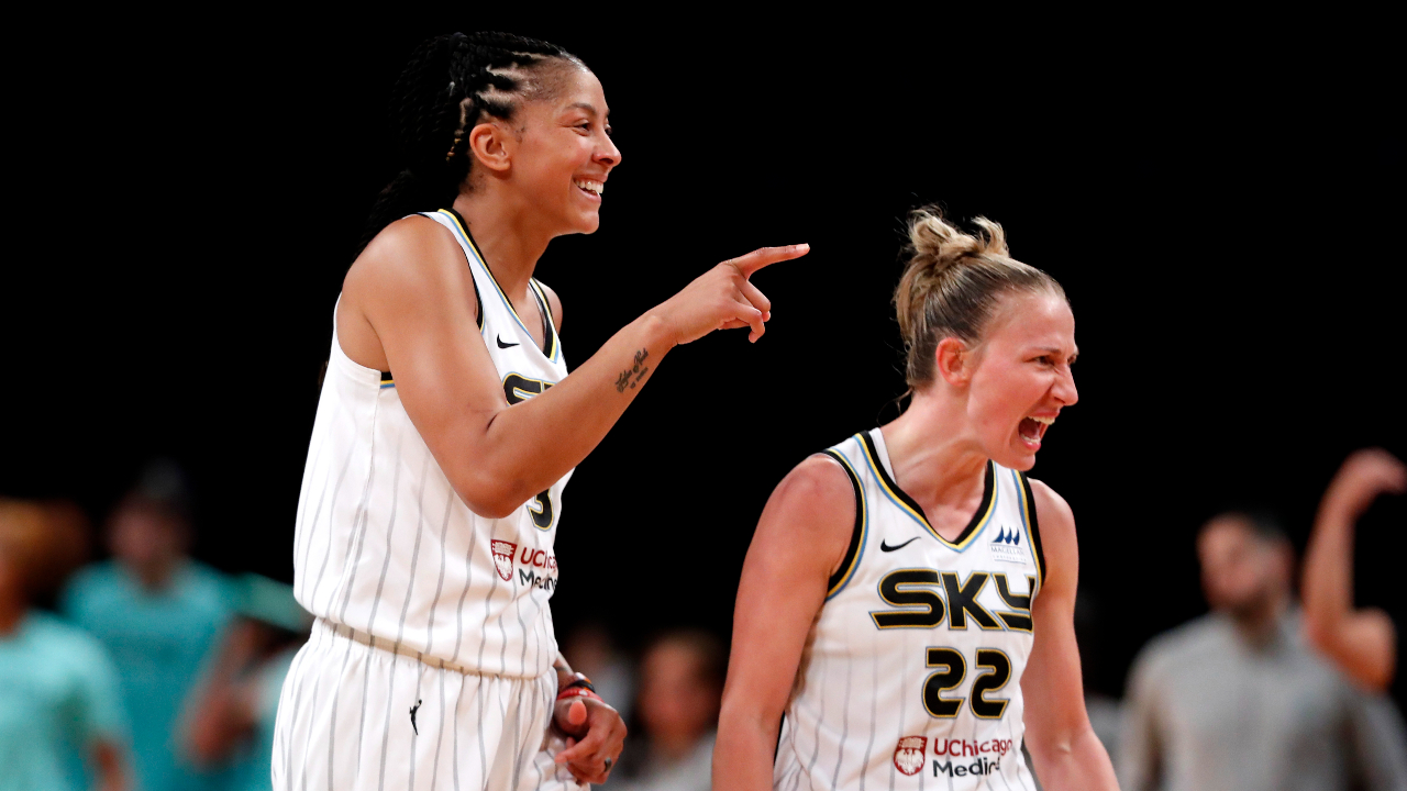Chicago Sky forward Candace Parker and guard Courtney Vandersloot (22) celebrate at a time out during the second half of a WNBA basketball playoff game against the New York Liberty Tuesday, Aug. 23, 2022, in New York. The Chicago Sky won 90-72. (AP Photo/Noah K. Murray)