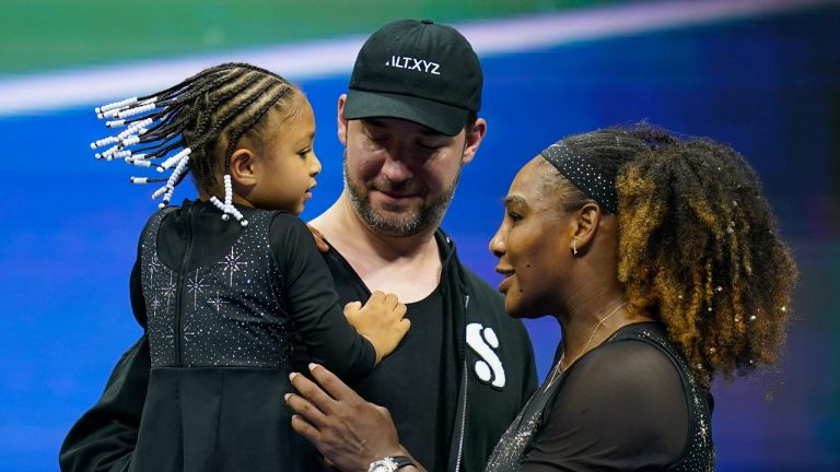Retired tennis star Serena Williams talks with her daughter Olympia and husband Alexis Ohanian during the first round of the US Open tennis championships, Monday, Aug. 29, 2022, in New York. (Charles Krupa/AP)