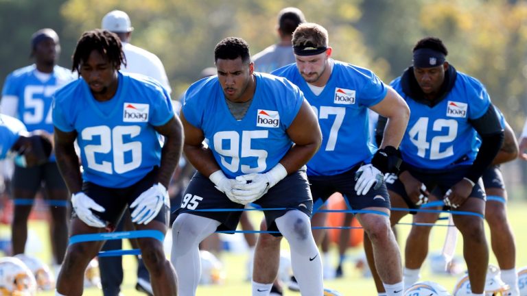Los Angeles Chargers cornerback Asante Samuel Jr. (26), defensive end Christian Covington (95), defensive end Joey Bosa (97) and linebacker Uchenna Nwosu (42) work on a drill during practice at the NFL football team's training camp in Costa Mesa, Calif., Wednesday, July 28, 2021. (Alex Gallardo/AP Photo)