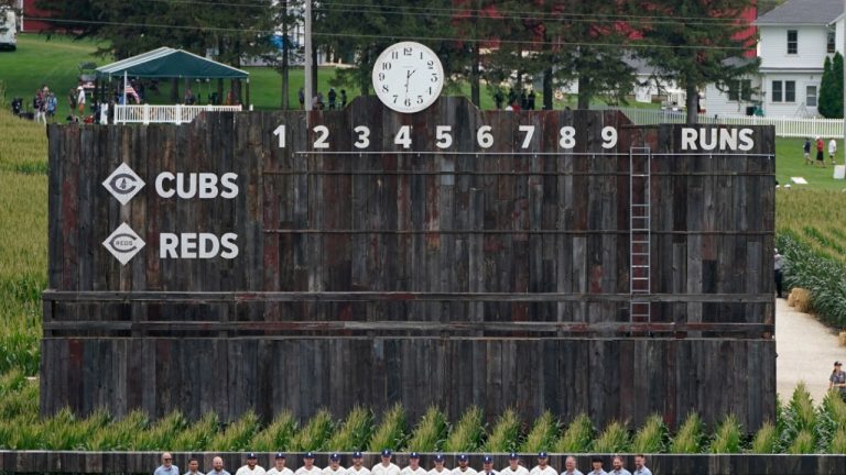 Chicago Cubs players pose for a team photo on the field before a baseball game against the Cincinnati Reds at the Field of Dreams movie site, Thursday, Aug. 11, 2022, in Dyersville, Iowa. (Charlie Neibergall/AP)