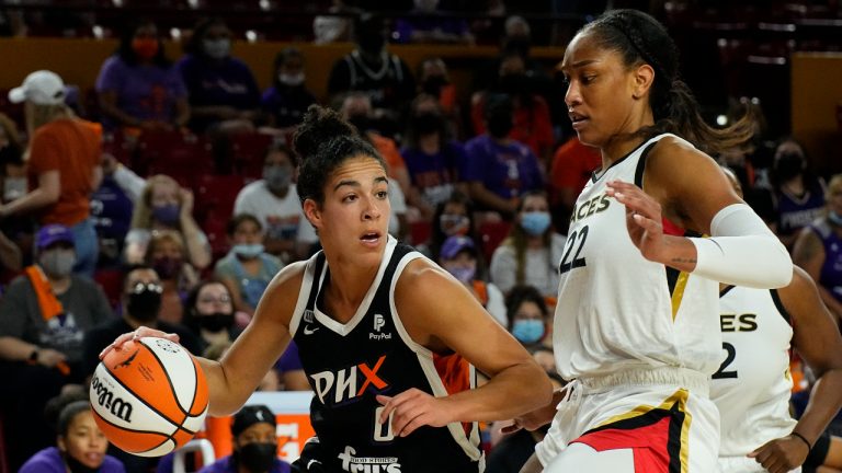 Phoenix Mercury guard Kia Nurse (0) drives on Las Vegas Aces forward A'ja Wilson during the first half of a WNBA basketball game Sunday, Oct. 3, 2021, in Phoenix. (Rick Scuteri/AP)