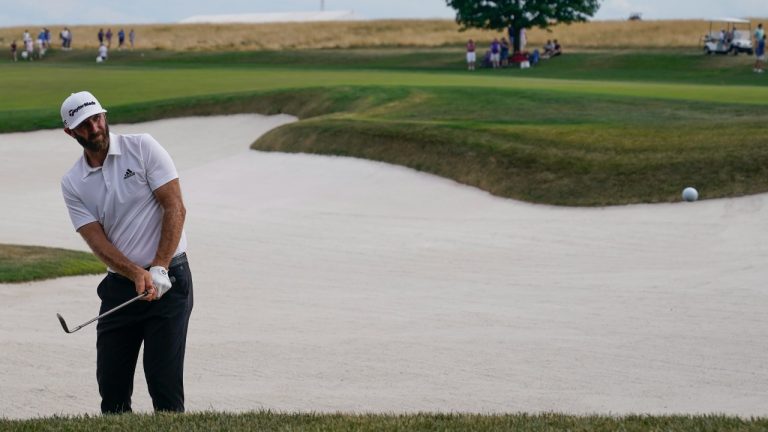 Dustin Johnson hits out of the rough on the 10th hole during the final round of the Bedminster Invitational LIV Golf tournament in Bedminster, N.J., Sunday, July 31, 2022. (Seth Wenig/AP)