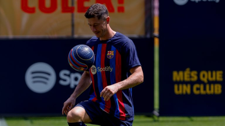 Polish forward Robert Lewandowski controls the ball during the official presentation after signing for FC Barcelona in Barcelona, Spain, Friday, Aug. 5, 2022. (Joan Monfort/AP)