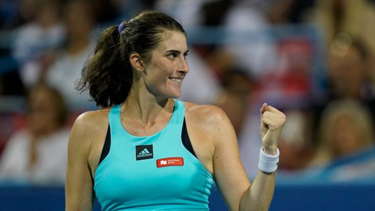 Rebecca Marino, of Canada, reacts after winning a first-round match against Venus Williams, of the United States, at the Citi Open tennis tournament in Washington, Monday, Aug. 1, 2022. (AP)