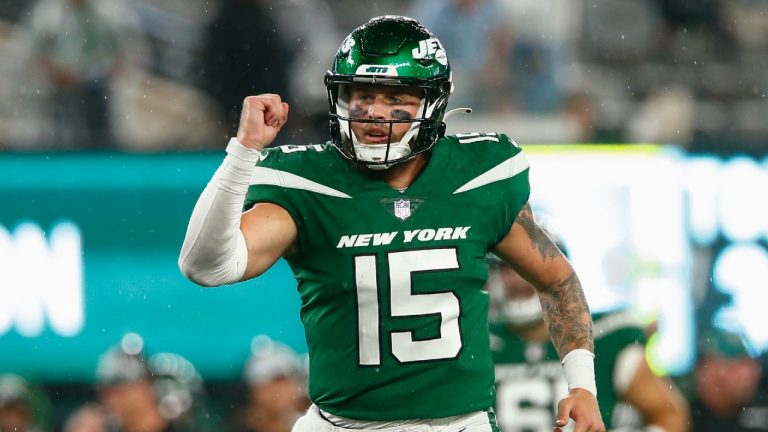 New York Jets quarterback Chris Streveler (15) celebrates after tight end Lawrence Cager runs in a touchdown during the second half of an NFL football game against the Atlanta Falcons, Monday, Aug. 22, 2022, in East Rutherford, N.J. (John Munson/AP)