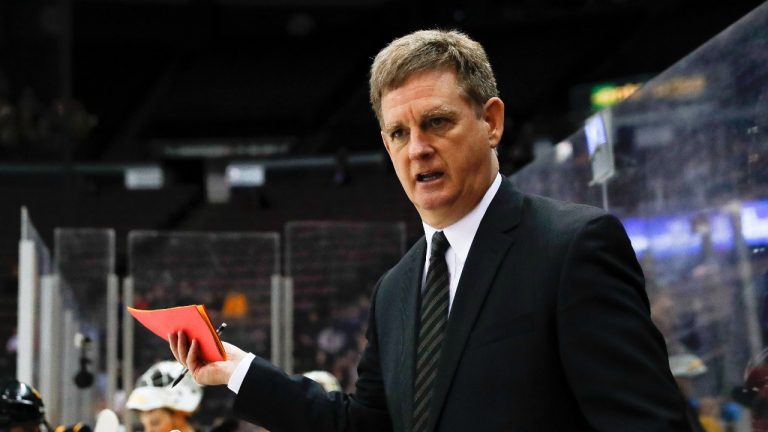Former Michigan Tech head coach Mel Pearson works the bench during the first period in the regional semifinals of the NCAA college hockey tournament against Denver, Saturday, March 25, 2017, in Cincinnati. (John Minchillo/AP)