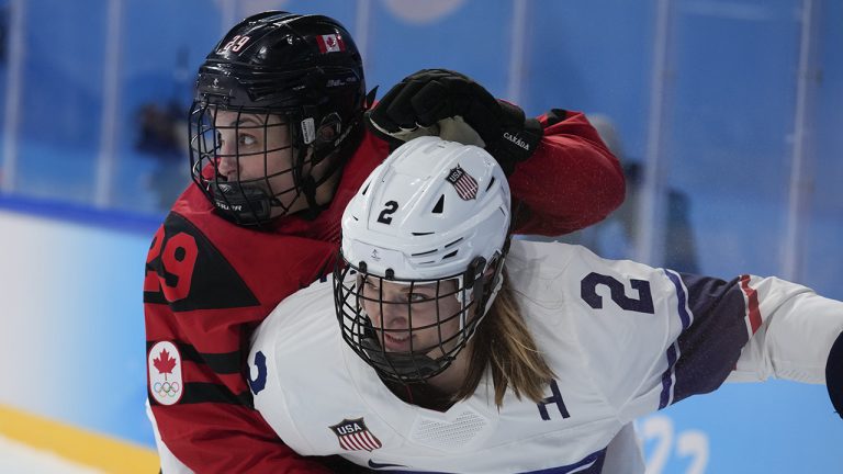 Canada's Marie-Philip Poulin collides United States' Lee Stecklein during the women's gold medal hockey game at the 2022 Winter Olympics, Thursday, Feb. 17, 2022, in Beijing. (Petr David Josek/AP)