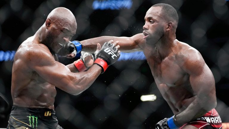 Kamaru Usman, left, fights with Leon Edwards during their welterweight championship bout at UFC 278 in Salt Lake City on Aug. 20, 2022. Edwards knocked out Usman with a head kick to win the title. (Francisco Kjolseth/The Salt Lake Tribune via AP)
