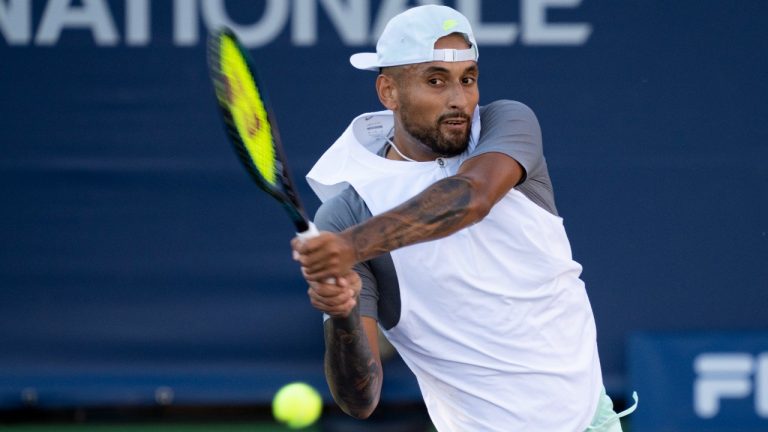 Nick Kyrgios, of Australia, returns to compatriot Alex de Minaur during round of sixteen play at the National Bank Open tennis tournament, Thursday, August 11, 2022 in Montreal. (Paul Chiasson/CP)
