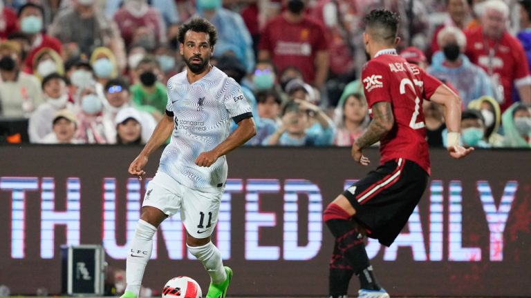 Liverpool's Mohamed Salah, left, controls the ball beside Manchester United Alex Telles during their pre-season soccer match against Manchester United. (Wason Wanichakorn/AP)