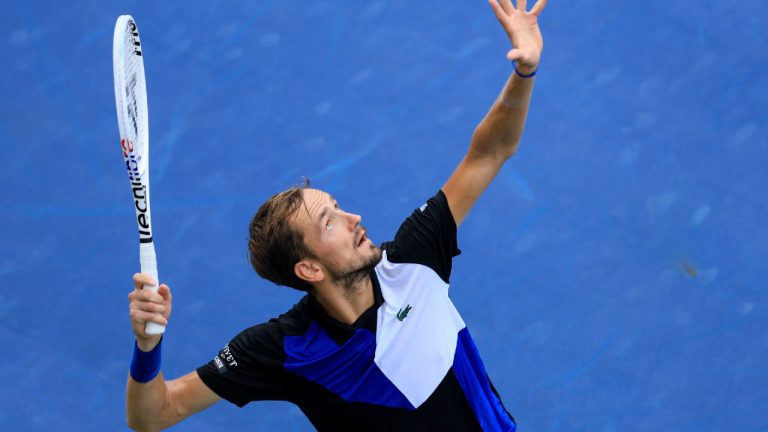 Daniil Medvedev, of Russia, serves to Denis Shapovalov, of Canada, during the Western & Southern Open tennis tournament, Thursday, Aug. 18, 2022, in Mason, Ohio. (Aaron Doster/AP)