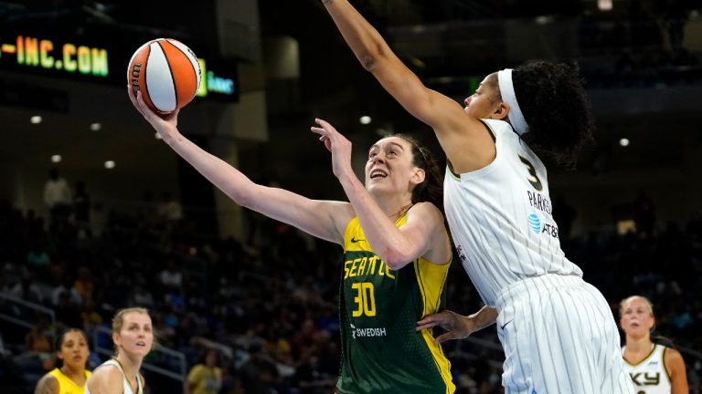Seattle Storm's Breanna Stewart (30) scores past Chicago Sky's Candace Parker during the second half of a WNBA basketball game Wednesday, July 20, 2022, in Chicago. The Sky won 78-74. (Charles Rex Arbogast/AP)