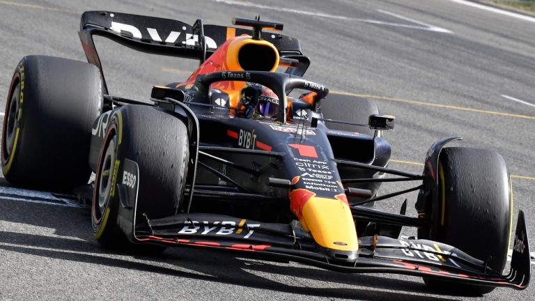Red Bull driver Max Verstappen of the Netherlands raises his fist as he crosses the finish line to win the Formula One Grand Prix at the Spa-Francorchamps racetrack in Spa, Belgium, Sunday, Aug. 28, 2022. (Geert Vanden Wijngaert/AP)