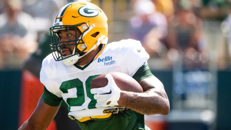 Green Bay Packers running back AJ Dillon (28) runs the ball during a joint NFL football training camp with the New Orleans Saints on Wednesday, Aug. 17, 2022, at Ray Nitschke Field in Ashwaubenon, Wis. (Samantha Madar/The Post-Crescent via AP)