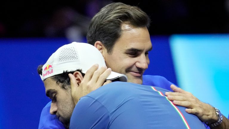 Team Europe's Matteo Berrettini, of Italy, celebrates with Roger Federer of Switzerland, after winning a match against Team World's Felix Auger-Aliassime, of Canada, on second day of the Laver Cup tennis tournament at the O2 in London, Saturday, Sept. 24, 2022. (Kin Cheung/AP)