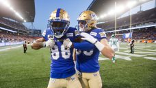 Blue Bombers clinch home playoff game with win over Roughriders