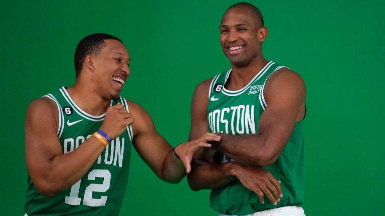 Boston Celtics forward Grant Williams, left, jokes with center Al Horford, right, as the NBA basketball players stand for photos during the team's Media Day, Monday, Sept. 26, 2022, in Canton, Mass. (Steven Senne/AP)