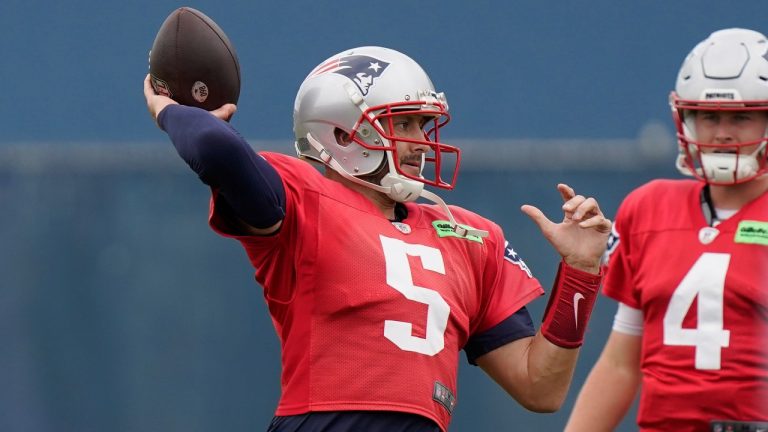 New England Patriots quarterback Brian Hoyer (5) winds up for a pass near quarterback Bailey Zappe (4) during an NFL football practice, Wednesday, Sept. 21, 2022, in Foxborough, Mass. (Steven Senne/AP)