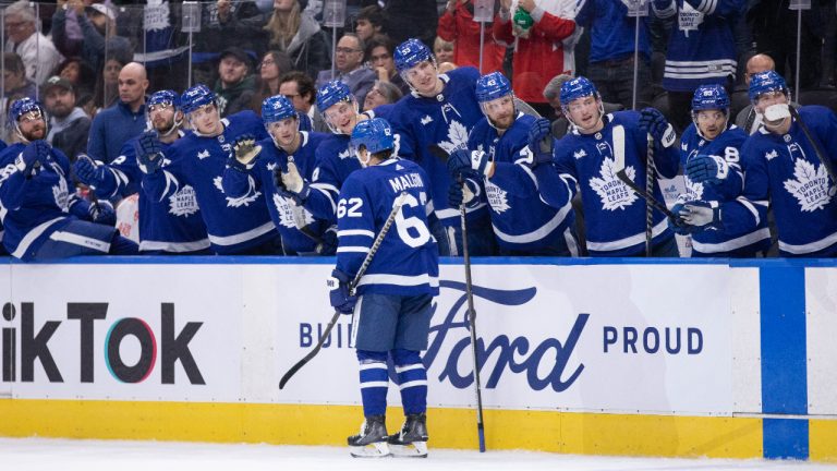 Toronto Maple Leafs teammates celebrate a goal against the Montreal Canadiens during second period NHL preseason action in Toronto. (Nick Iwanyshyn/CP)