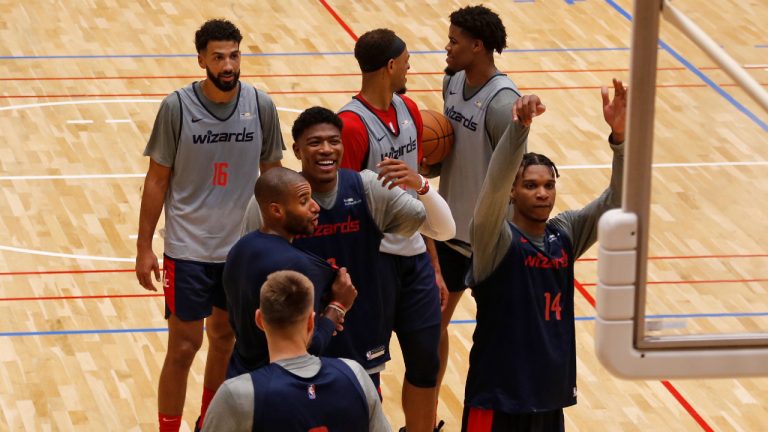 Washington Wizards players including Rui Hachimura, center, and Isaiah Todd (14) work out in Tokyo, Thursday, Sept. 29, 2022, ahead of the NBA preseason games in Japan. Japanese basketball fans will get to see NBA stars up close when the reigning league-champion Golden State Warriors take on the Washington Wizards in two preseason games. (AP Photo/Yuri Kageyama)
