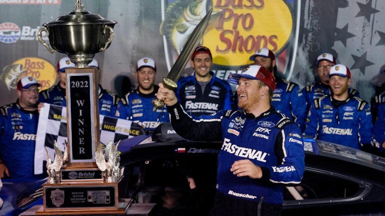 Chris Buescher celebrates with his trophy and sword after winning a NASCAR Cup Series auto race at Bristol Motor Speedway Saturday, Sept. 17, 2022, in Bristol, Tenn. (Mark Humphrey/AP)