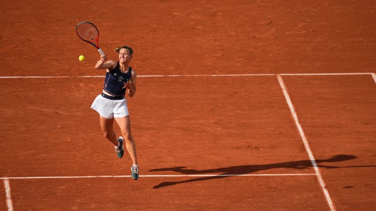 France's Fiona Ferro slams a forehand to Spain's Paula Badosa during their first round match of the French Open tennis tournament at the Roland Garros stadium Tuesday, May 24, 2022 in Paris. (Michel Euler/AP)