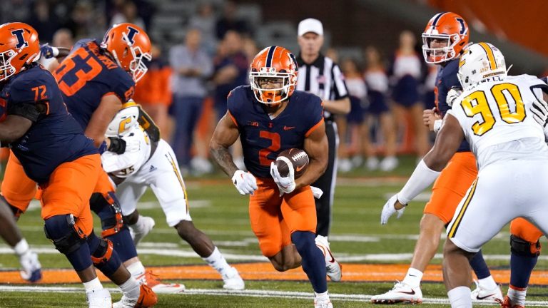 Illinois running back Chase Brown breaks into the open during the first half of the team's NCAA college football game against Chattanooga on Thursday, Sept. 22, 2022, in Champaign, Ill. (Charles Rex Arbogast/AP)