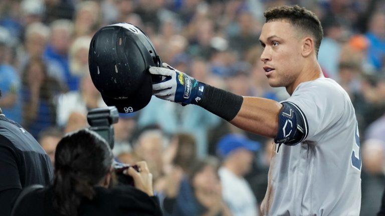 New York Yankees designated hitter Aaron Judge (99) celebrates his 61st home run of the season, a two-run shot, against the Toronto Blue Jays and acknowledges his family during seventh inning American League MLB baseball action in Toronto on Wednesday, September 28, 2022. (Nathan Denette/THE CANADIAN PRESS)