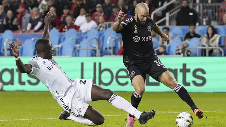 Toronto FC defender Chris Mavinga (23) slides into Inter Miami forward Gonzalo Higuaín (10) during first half MLS soccer action in Toronto on Friday, September 30, 2022. (Nathan Denette/CP)