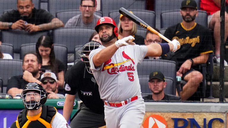 St. Louis Cardinals' Albert Pujols (5) watches his 697th career home run, a two-run home run off Pittsburgh Pirates relief pitcher Chase De Jong, during the ninth inning of a baseball game in Pittsburgh, Sunday, Sept. 11, 2022. (Gene J. Puskar/AP)