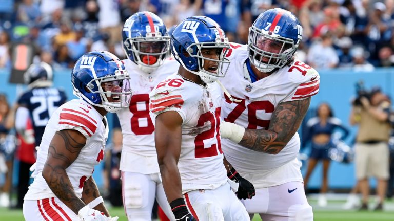 New York Giants running back Saquon Barkley (26) celebrates after making a touchdown run against the Tennessee Titans during the second half of an NFL football game. (Mark Zaleski/AP)